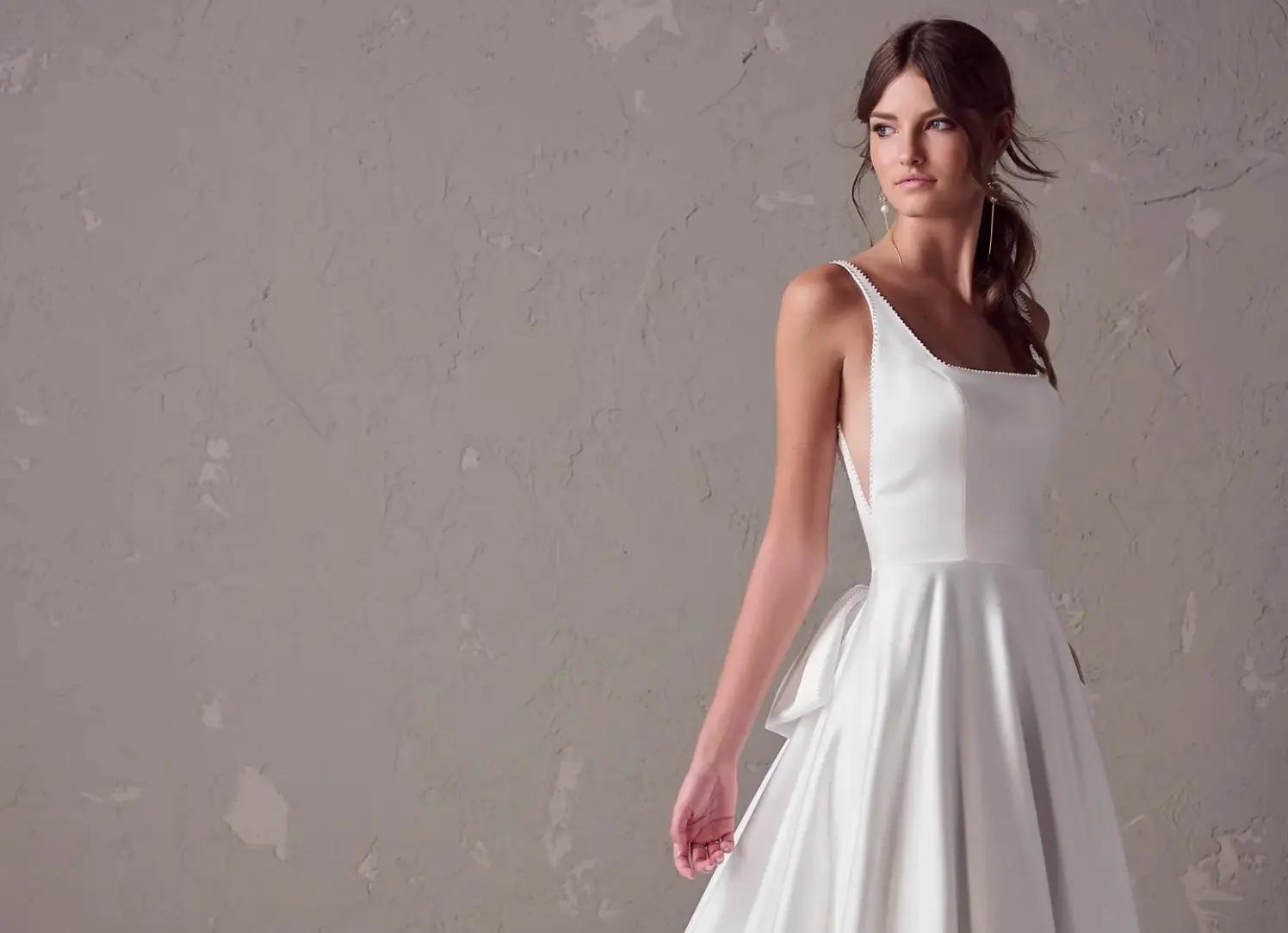 Model wearing white Rebecca Ingram dress